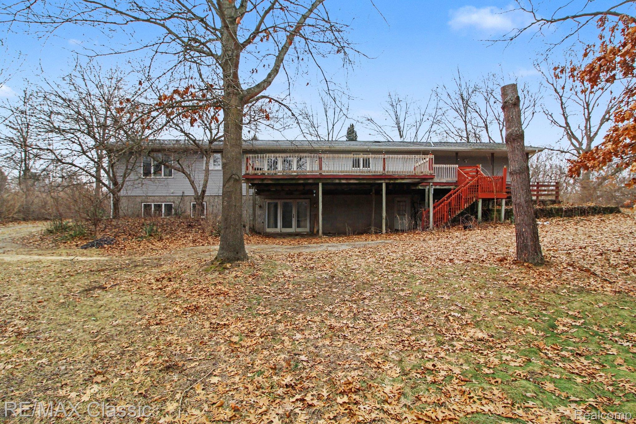 9800 Moon Road Saline, MI 48176 - Photo 31 of 38 Back of property featuring the tiered deck and stairway
