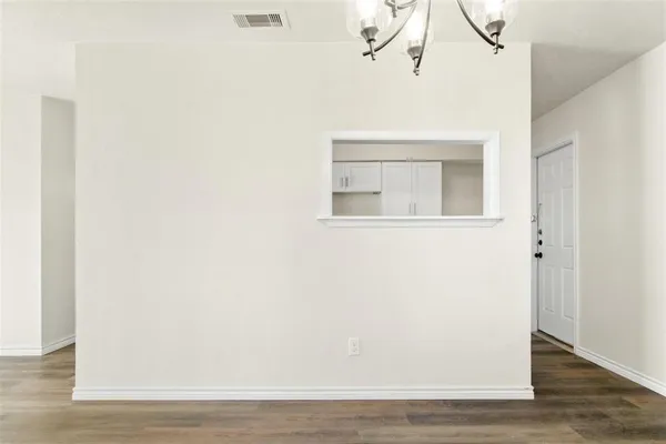 a view of a small space with wooden floor