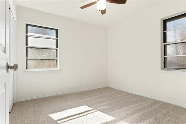 a bathroom with a toilet a sink a mirror and bathtub