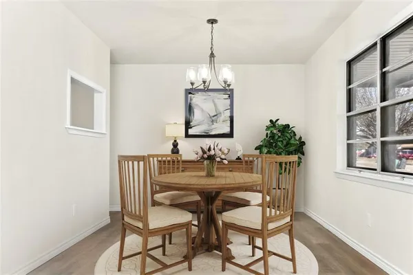 a dining room with furniture and window