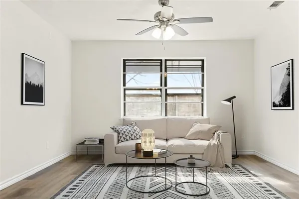 a living room with furniture and a window
