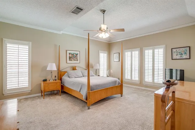 a bed room with a bed and a chandelier