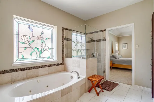 a bathroom with a tub toilet and sink