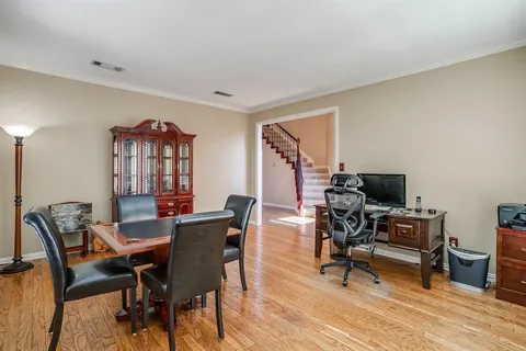 a workspace with furniture and wooden floor
