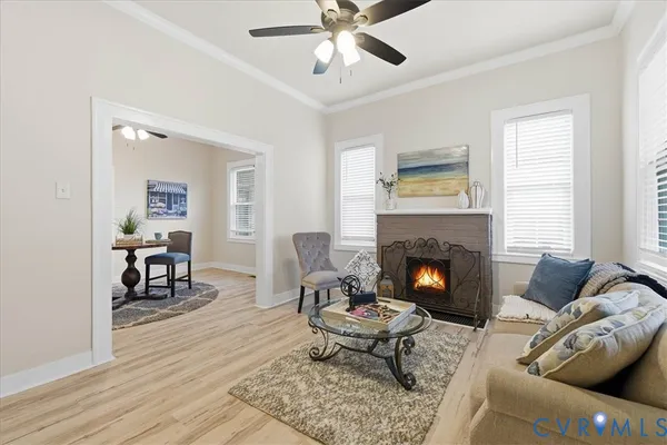 a living room with furniture and a fireplace
