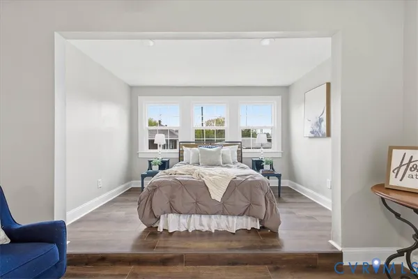 a bed room with a bed and a window