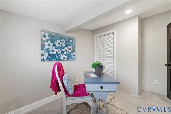 a workspace with furniture and window