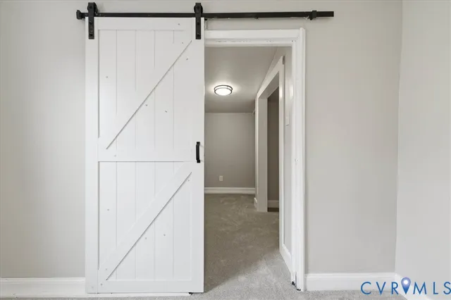 a bedroom with a bed and a table