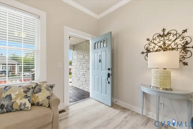 a living room with furniture and window