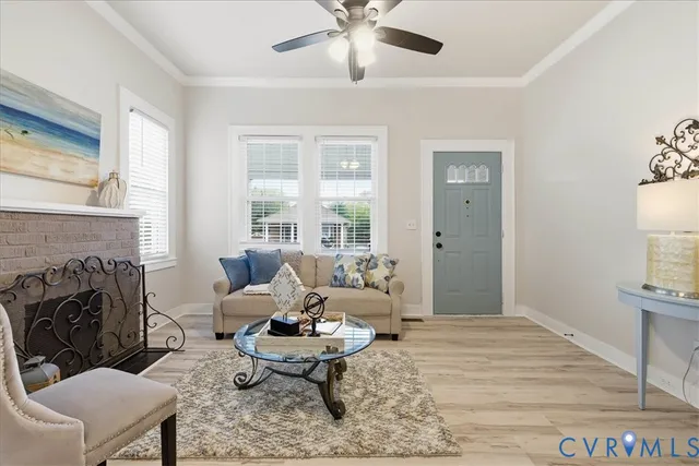 a living room with furniture and a fireplace