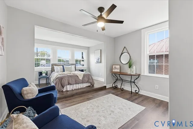 a bed room with furniture and a window