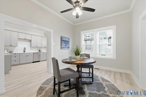 a view of a dining room with furniture and wooden floor