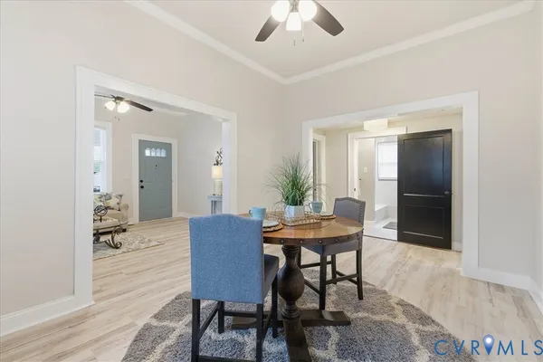 a view of a dining room with furniture and wooden floor