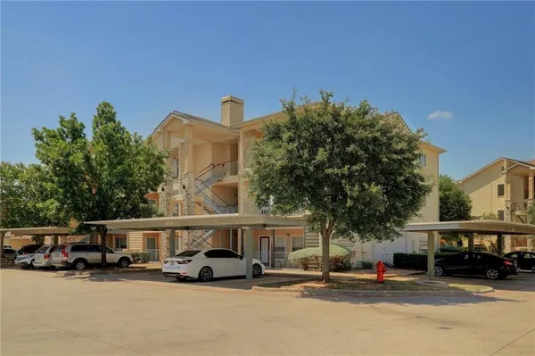 a view of car parked in front of building
