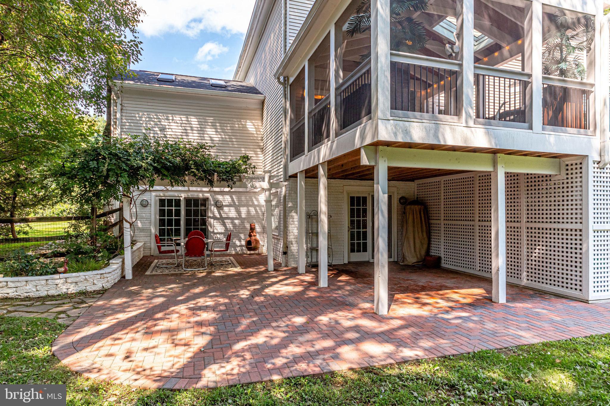 1167 Reston Avenue Herndon, VA 20170 - Photo 56 of 60 Screened in porch with brick pavers below