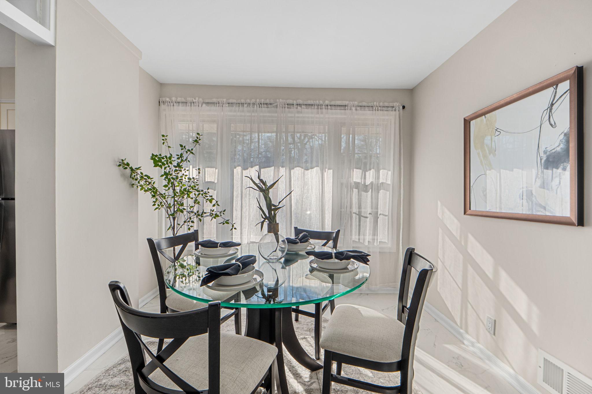 1513 Flora Lane Silver Spring, MD 20910 - Photo 9 of 49 a view of a dining room with furniture and window