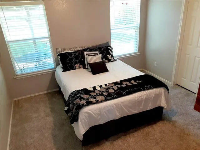 a view of a backyard with a patio