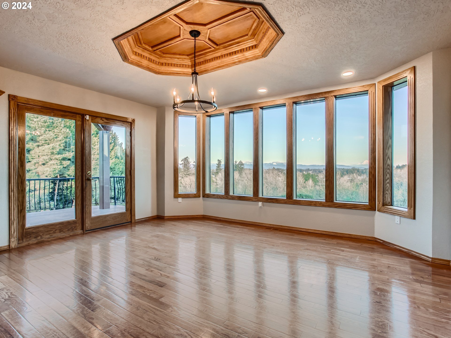 1411 Northwest 211th Circle Ridgefield, WA 98642 - Photo 11 of 47 a view of an empty room with a window and wooden floor