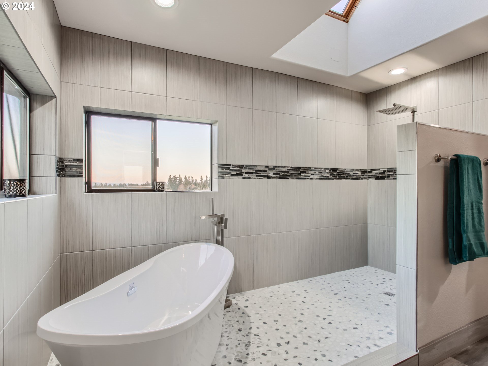 1411 Northwest 211th Circle Ridgefield, WA 98642 - Photo 20 of 47 a bathroom with a bathtub and a shower