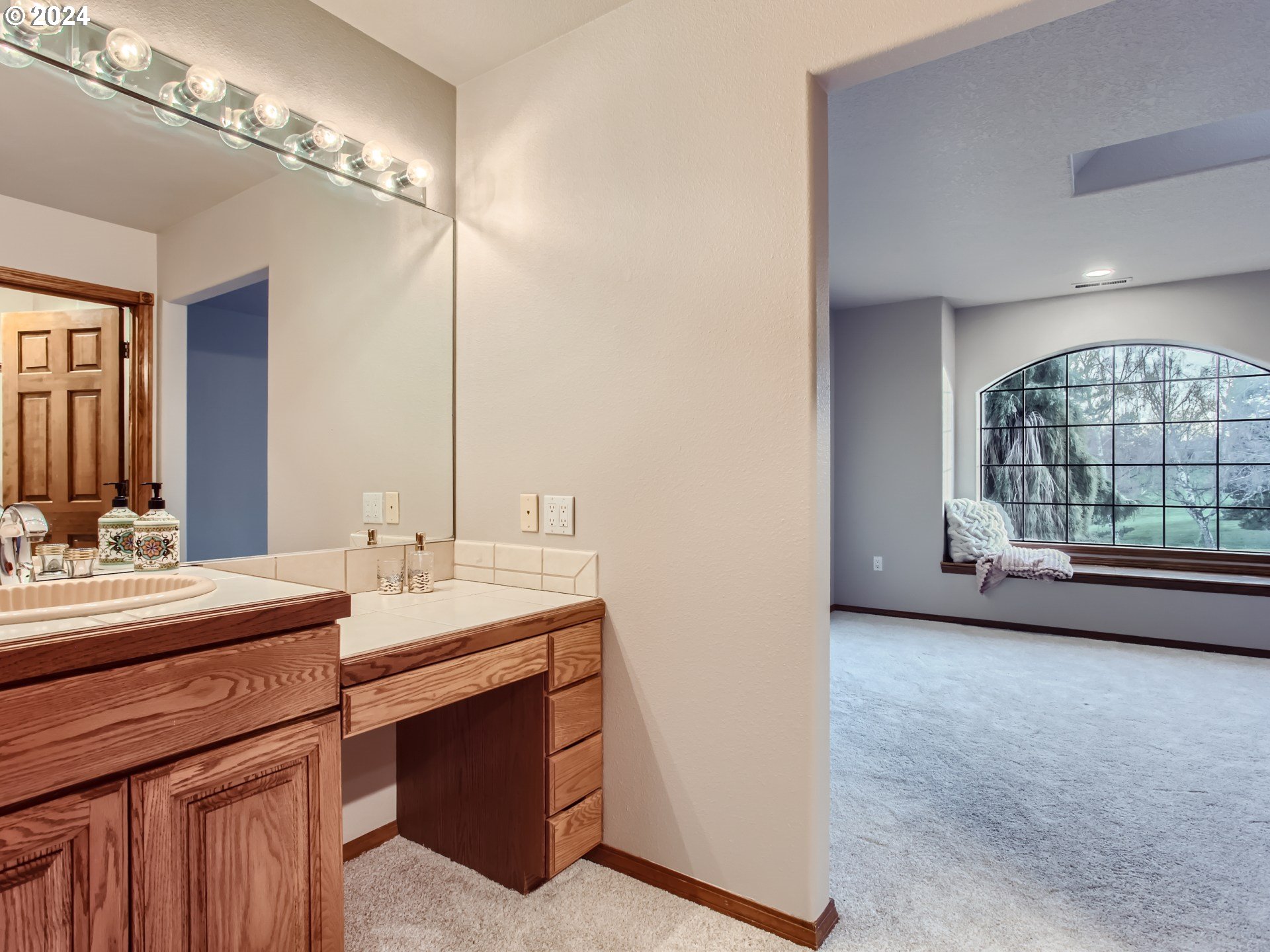 1411 Northwest 211th Circle Ridgefield, WA 98642 - Photo 26 of 47 a bathroom with a double vanity sink and a mirror