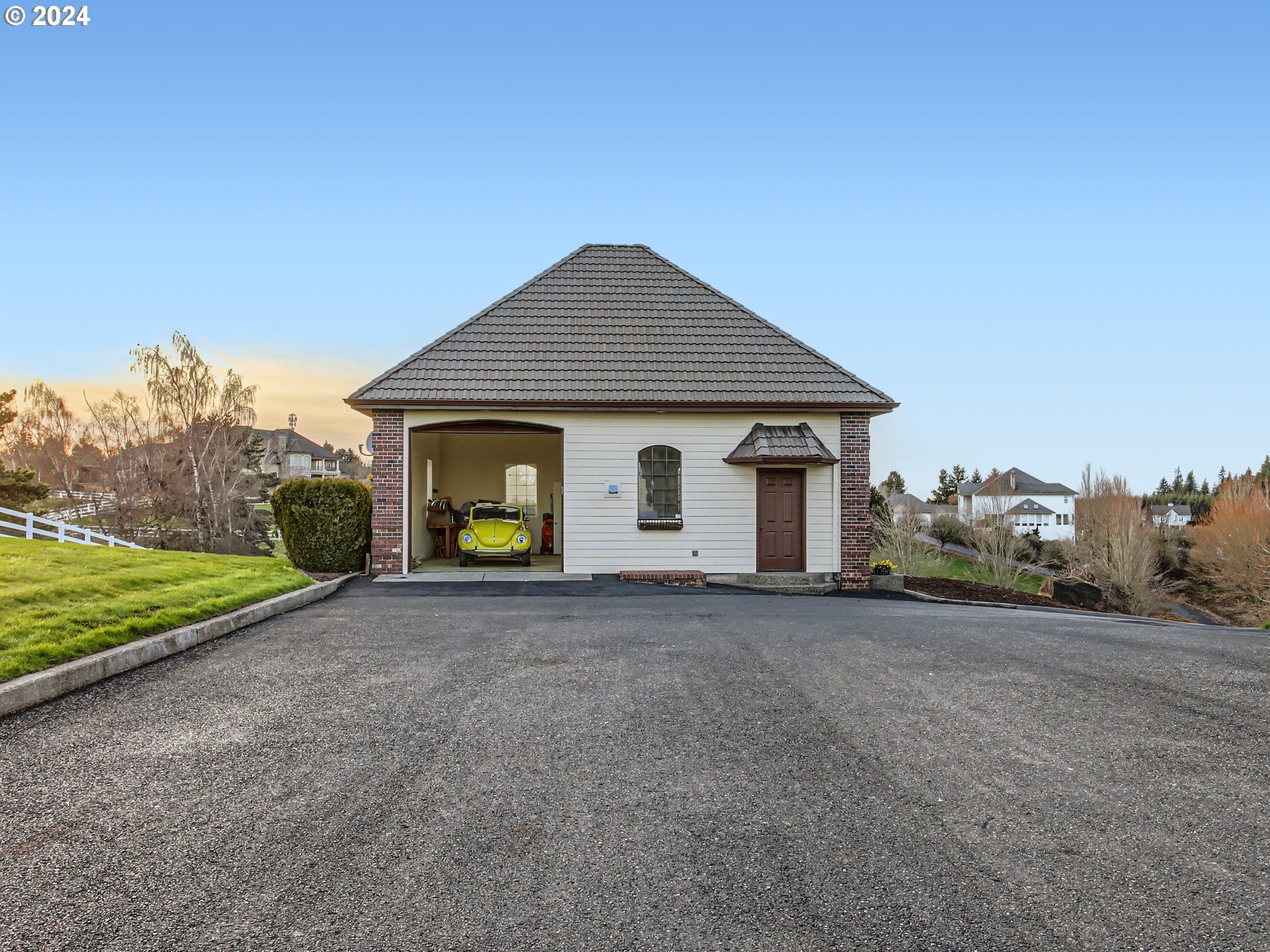1411 Northwest 211th Circle Ridgefield, WA 98642 - Photo 42 of 47 a front view of a house with a yard and garage