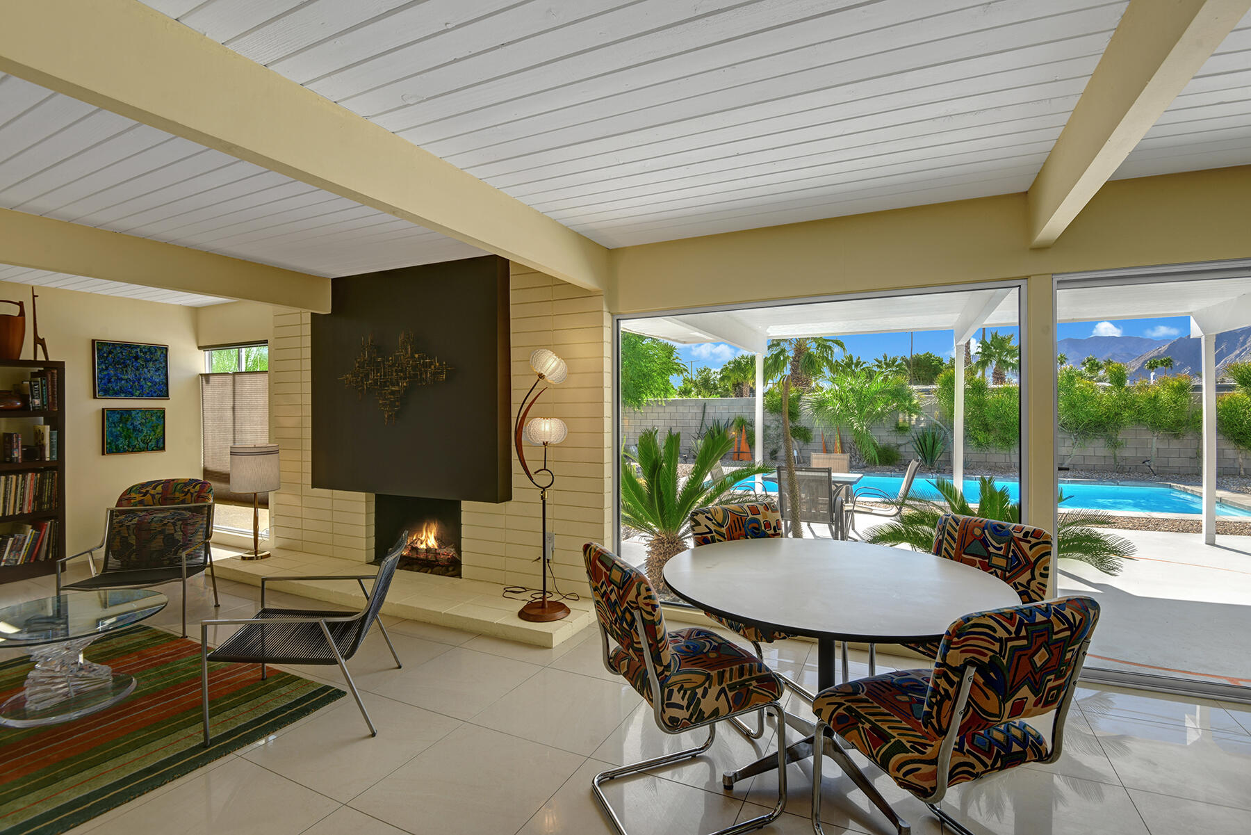 565 East Racquet Club Road Palm Springs, CA 92262 - Photo 12 of 38 DINING ROOM AND LIVING ROOM TO POOL YARD