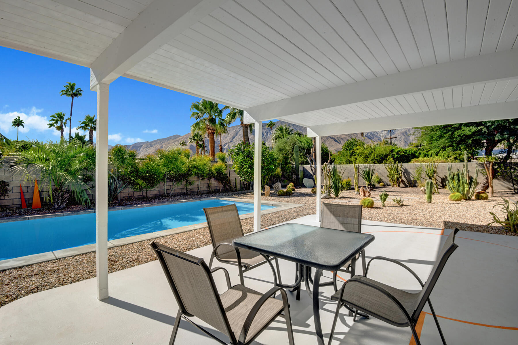 565 East Racquet Club Road Palm Springs, CA 92262 - Photo 27 of 38 BACK COVERED DINING PATIO TO POOL AND MO