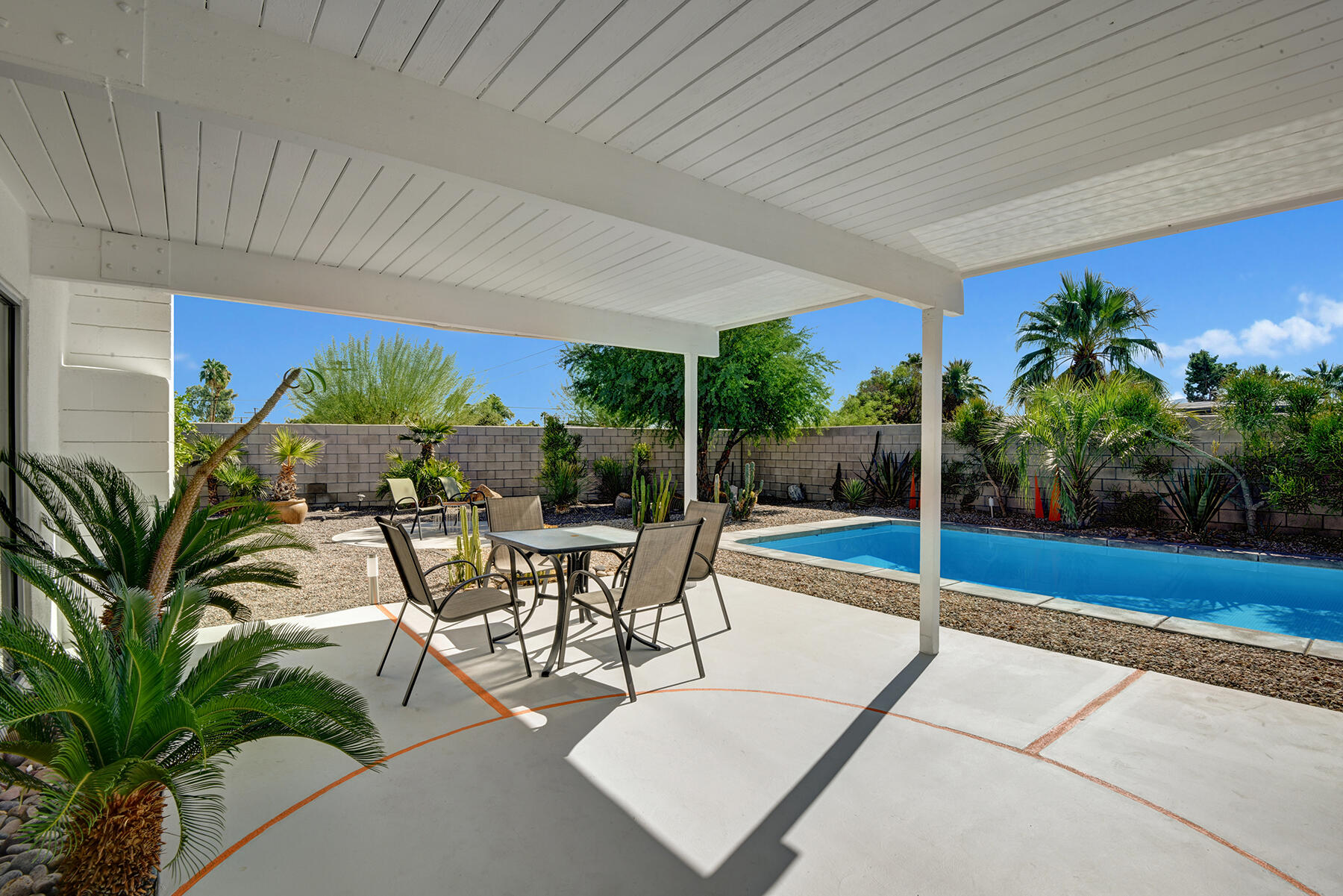 565 East Racquet Club Road Palm Springs, CA 92262 - Photo 32 of 38 BACK COVERED DINING PATIO REVERSE TO POO
