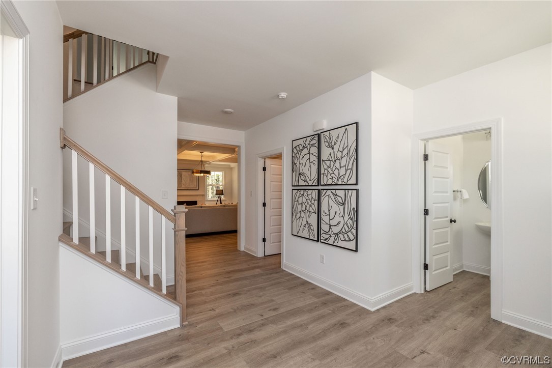 9107 Copplestone Road Chesterfield, VA 23832 - Photo 9 of 22 a view of a hallway with wooden floor and entryway