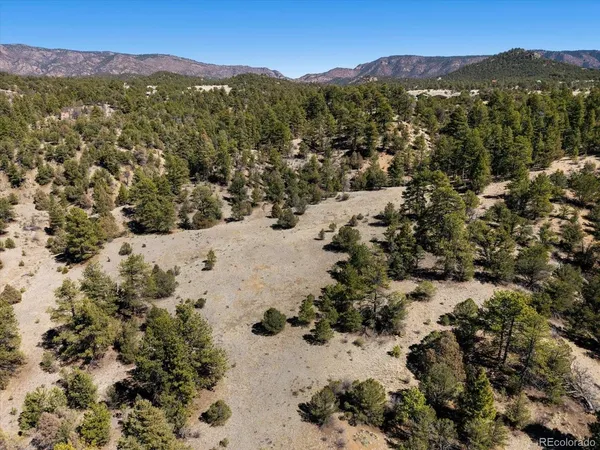 a view of a mountain with a mountain in the background