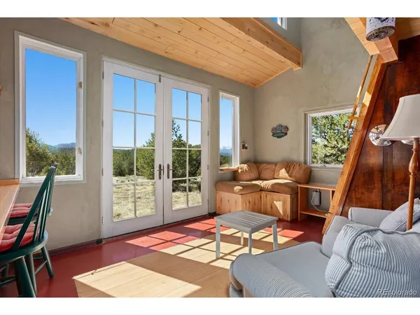 a living room with a couch next to a window