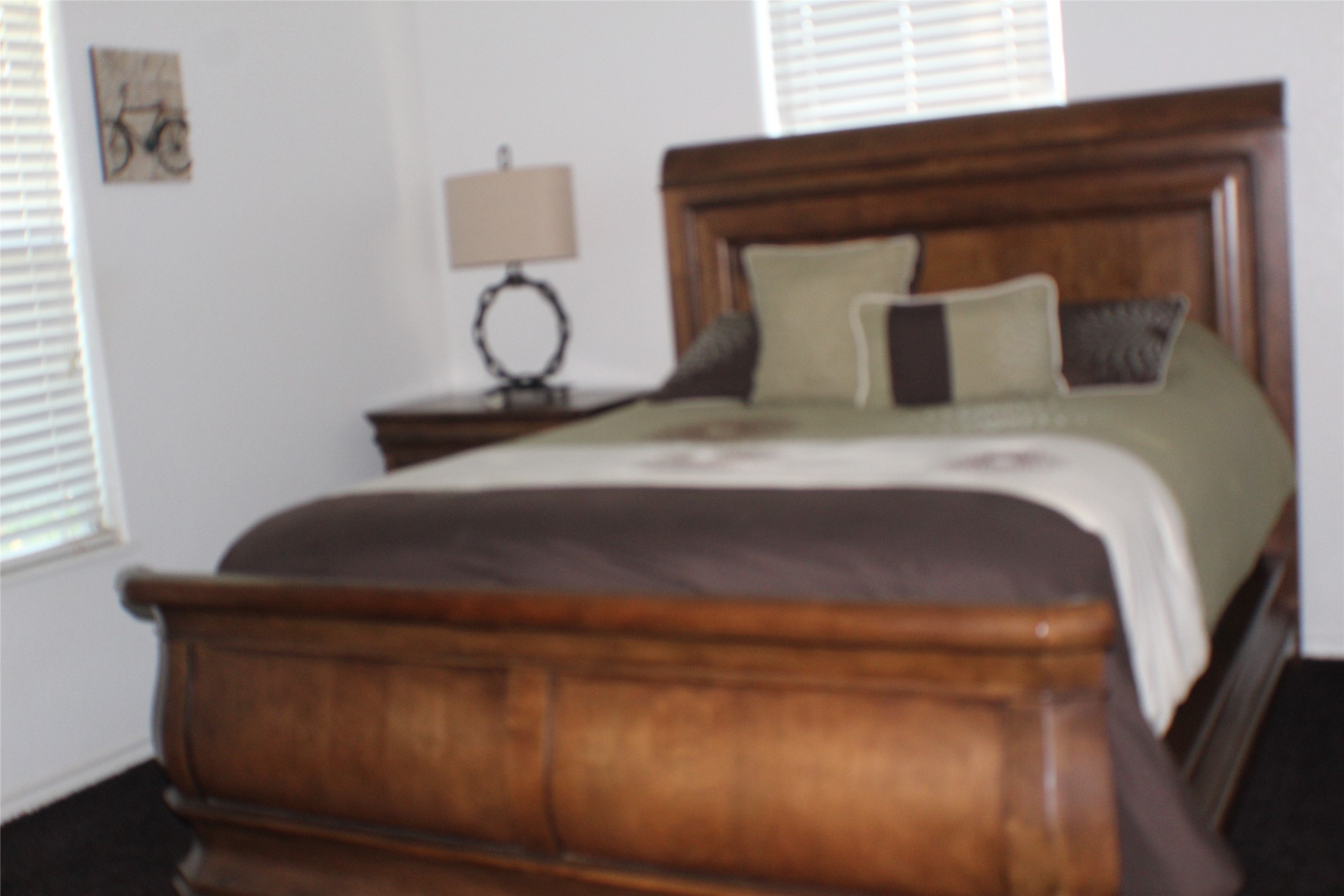 1316 Rampart Street Bay City, TX 77414 - Photo 14 of 15 a bedroom with a bed and window