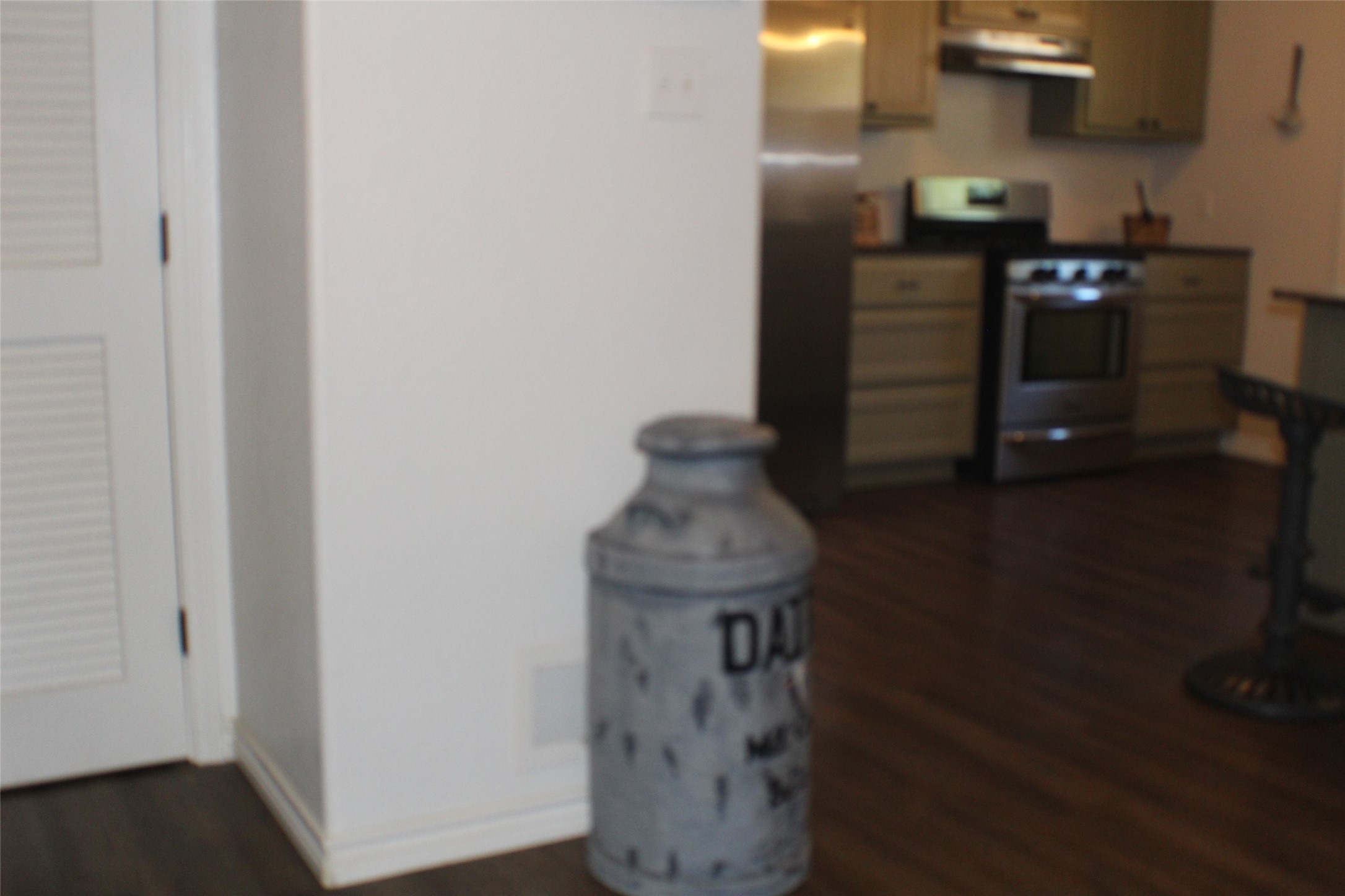 1316 Rampart Street Bay City, TX 77414 - Photo 15 of 15 a kitchen with a refrigerator and a stove top oven