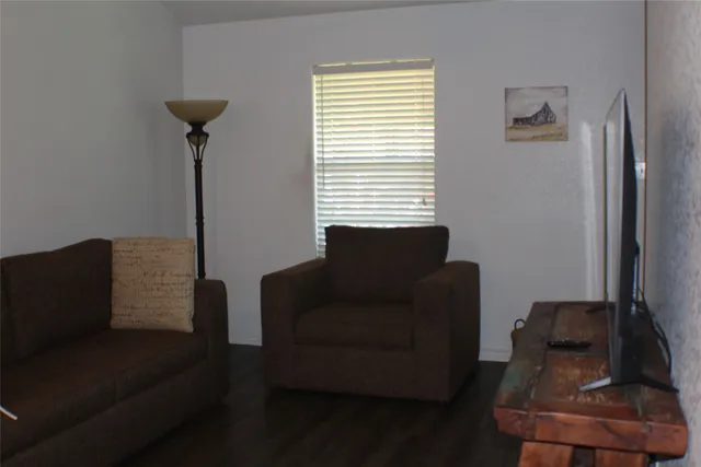 a living room with furniture and a window