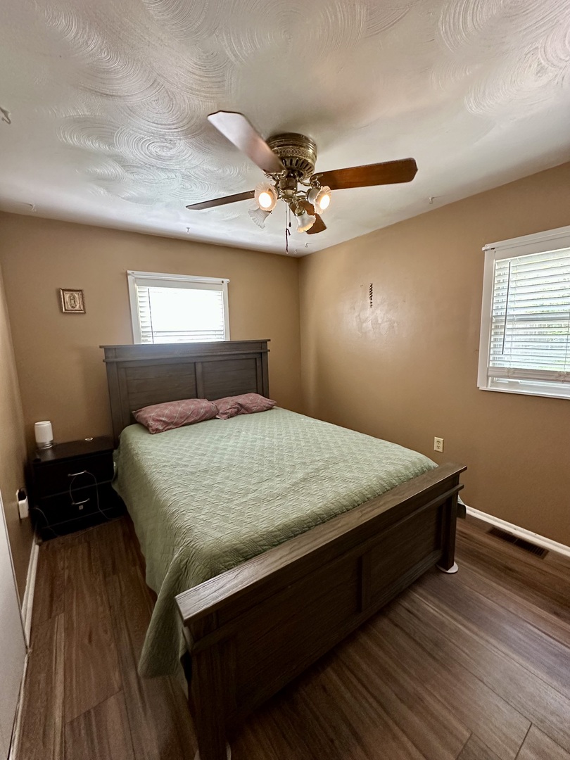 925 Assembly Place Dixon, IL 61021 - Photo 12 of 19 a bedroom with a bed and a chandelier