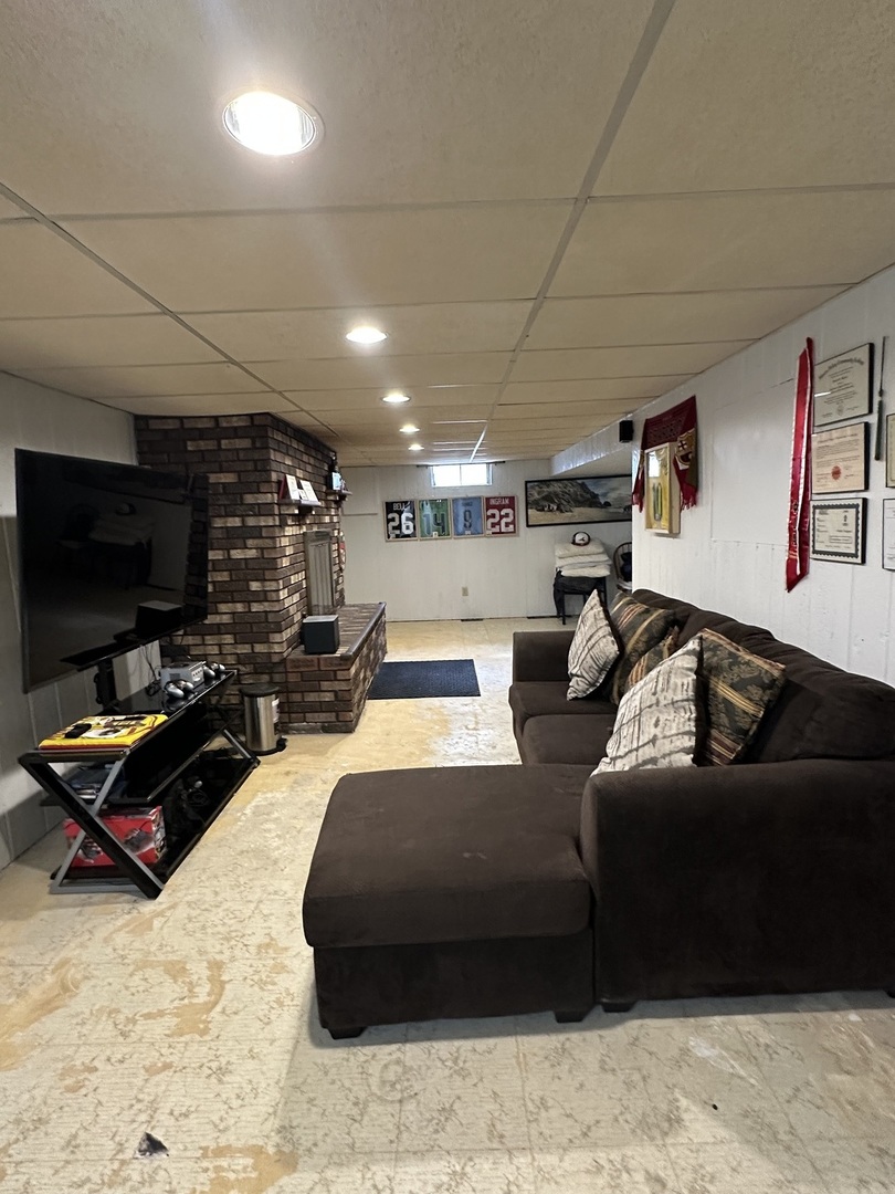 925 Assembly Place Dixon, IL 61021 - Photo 16 of 19 a living room with furniture a flat screen tv and kitchen view