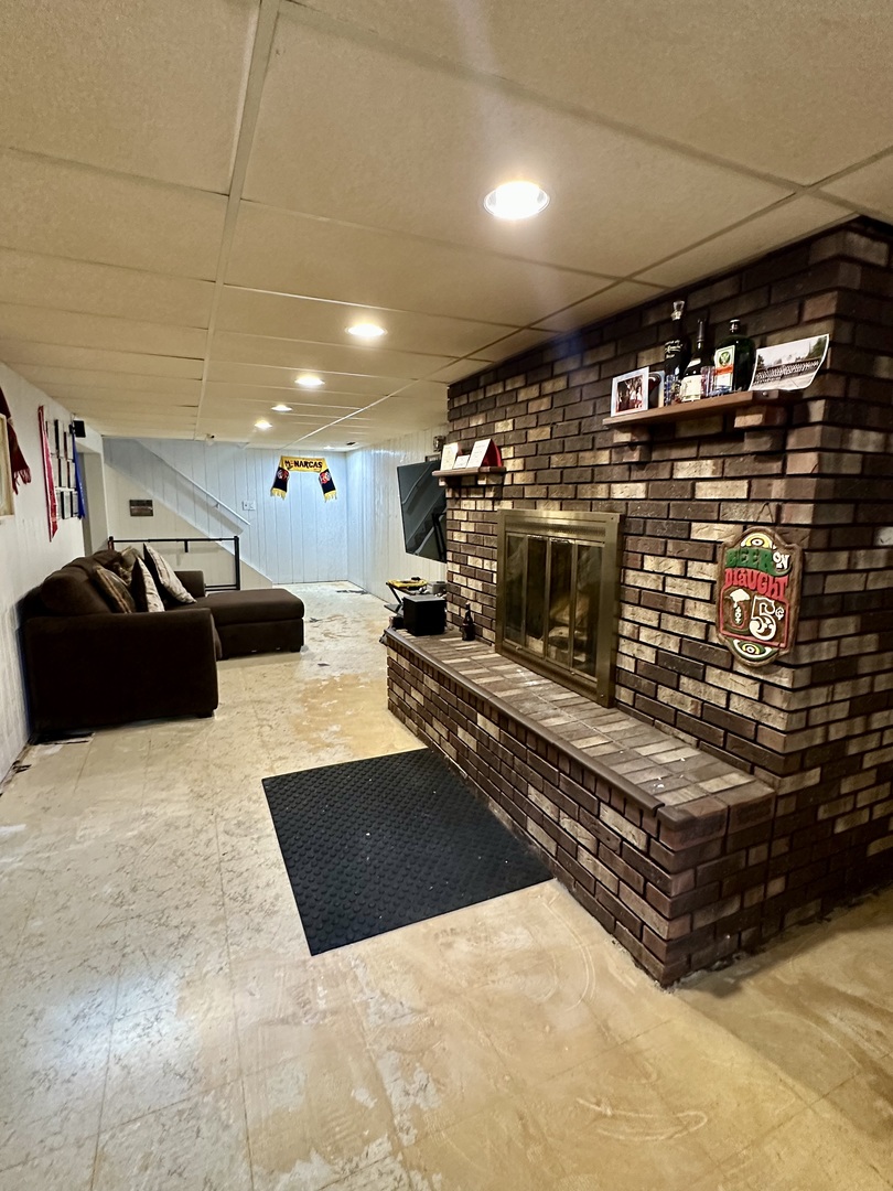 925 Assembly Place Dixon, IL 61021 - Photo 19 of 19 a kitchen with stainless steel appliances kitchen island granite countertop a stove and a sink