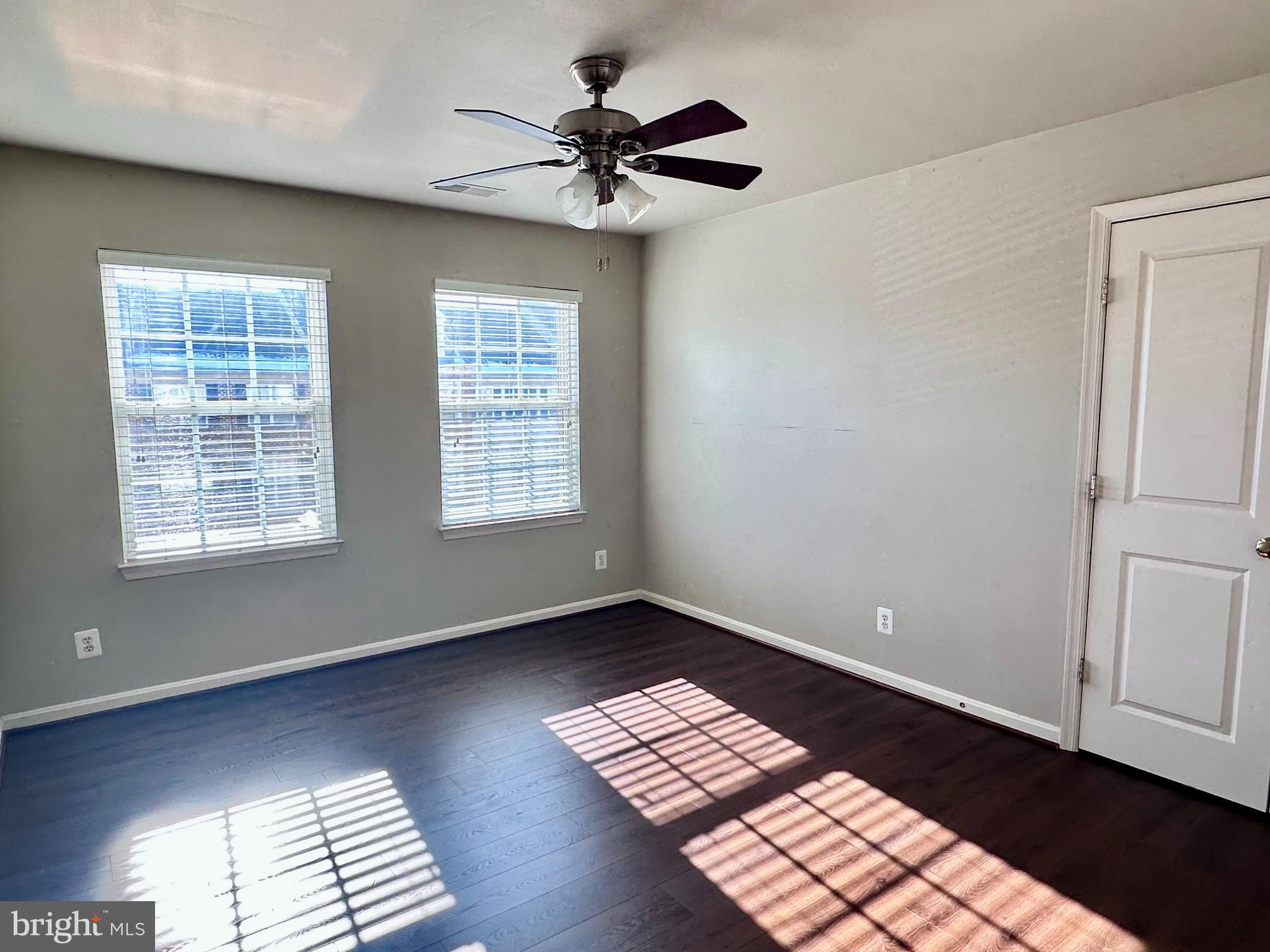 43270 Sunderleigh Square Broadlands, VA 20148 - Photo 15 of 24 a view of an empty room with window and wooden floor