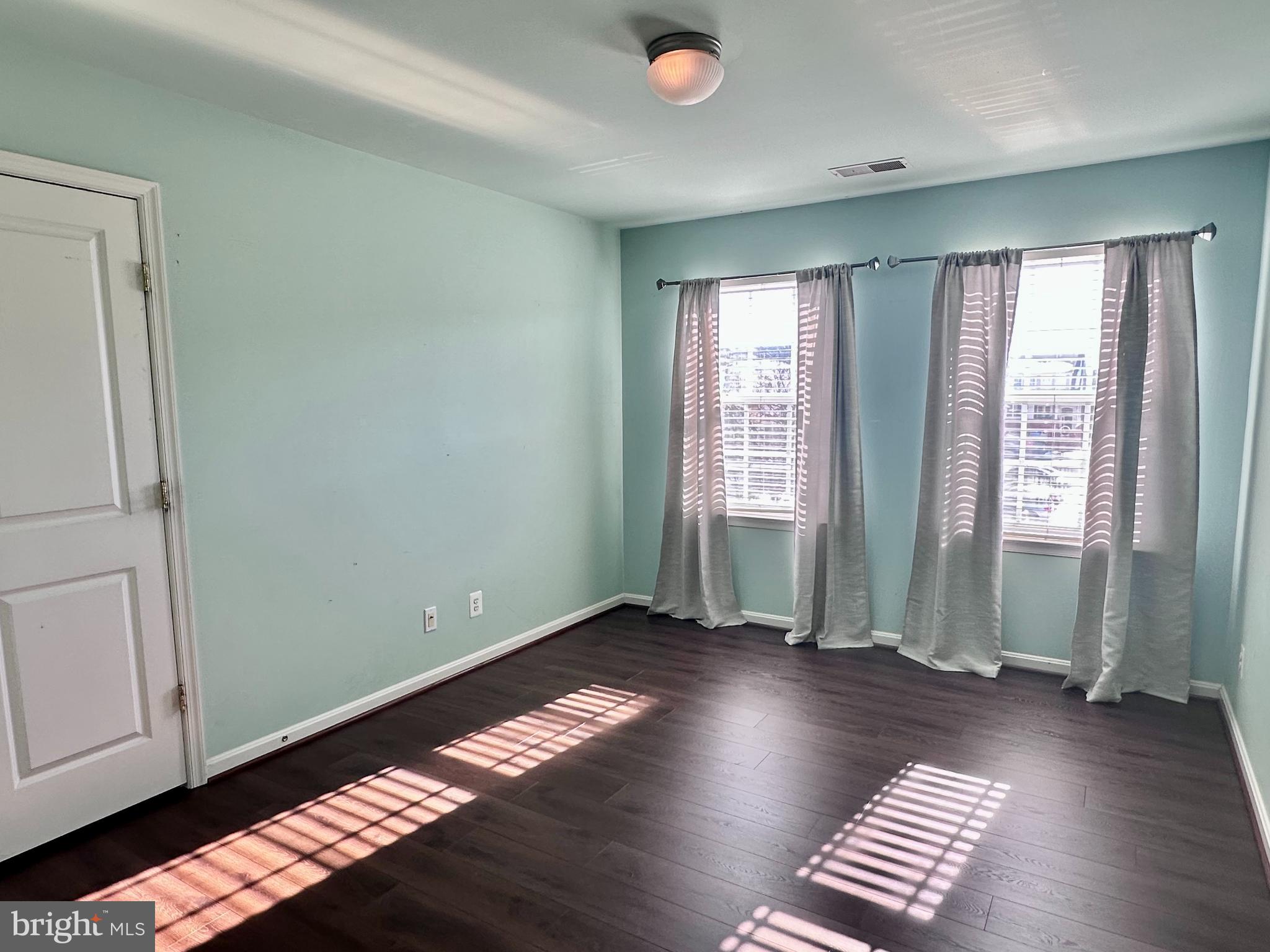 43270 Sunderleigh Square Broadlands, VA 20148 - Photo 17 of 24 an empty room with wooden floor and windows