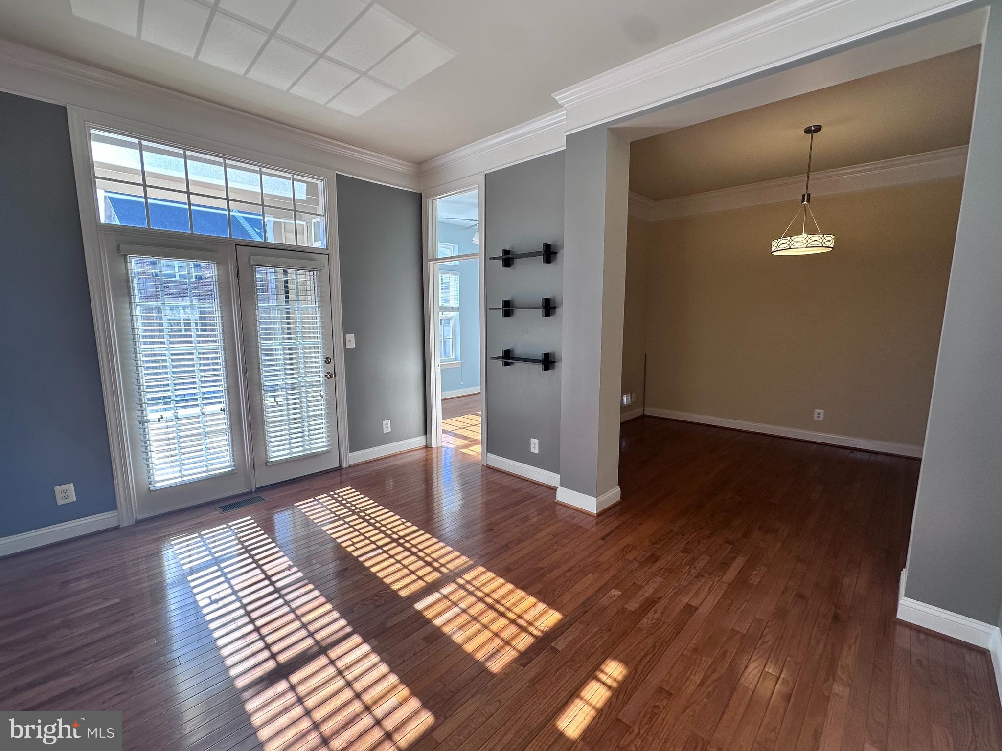 43270 Sunderleigh Square Broadlands, VA 20148 - Photo 7 of 24 an empty room with wooden floor and windows