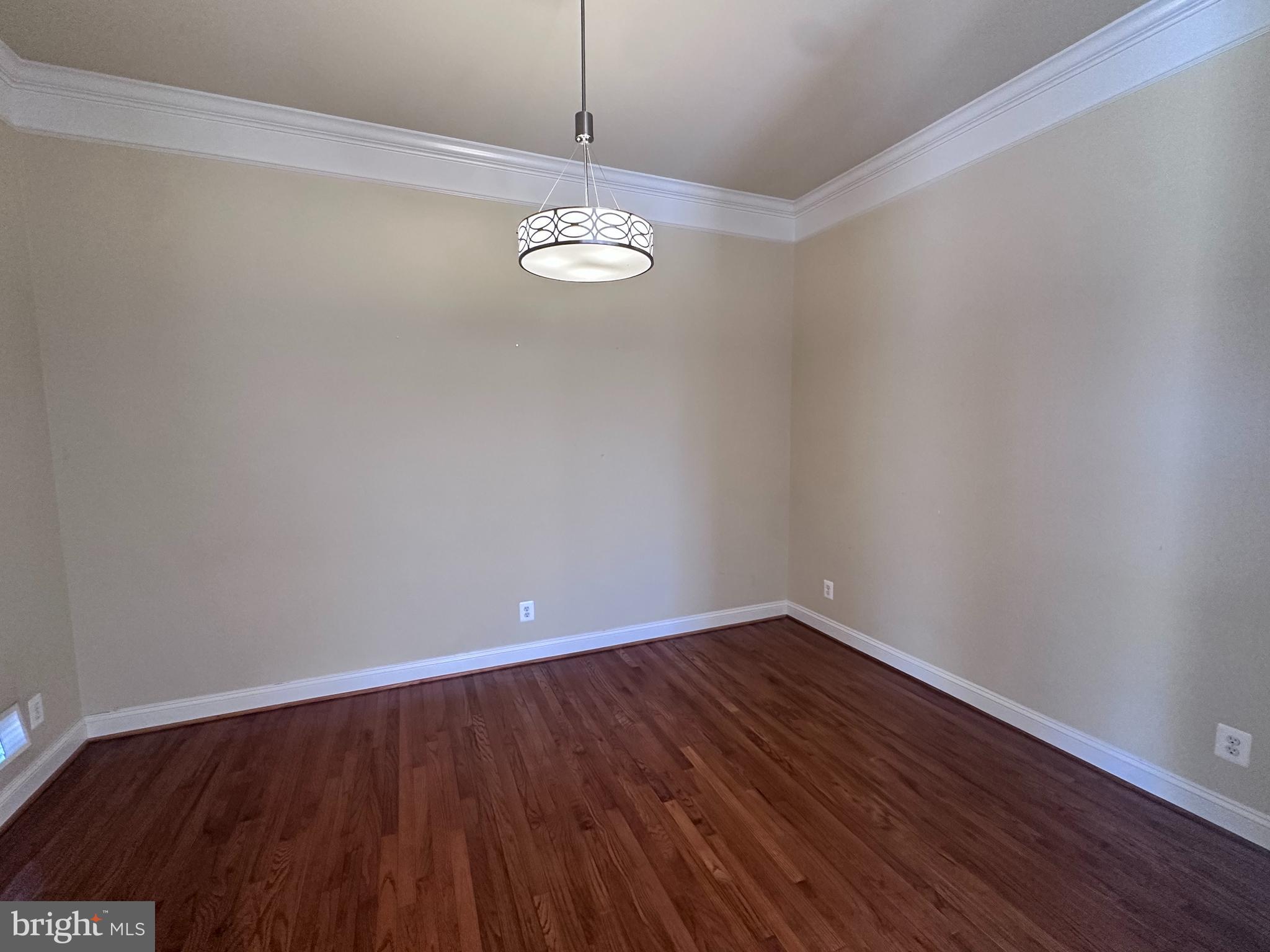 43270 Sunderleigh Square Broadlands, VA 20148 - Photo 9 of 24 a view of empty room with wooden floor and window