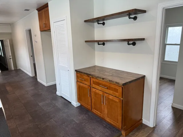 a utility room with cabinets washer and dryer
