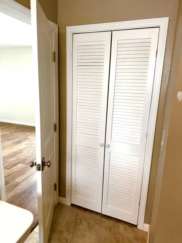 a view of a hallway with closet area