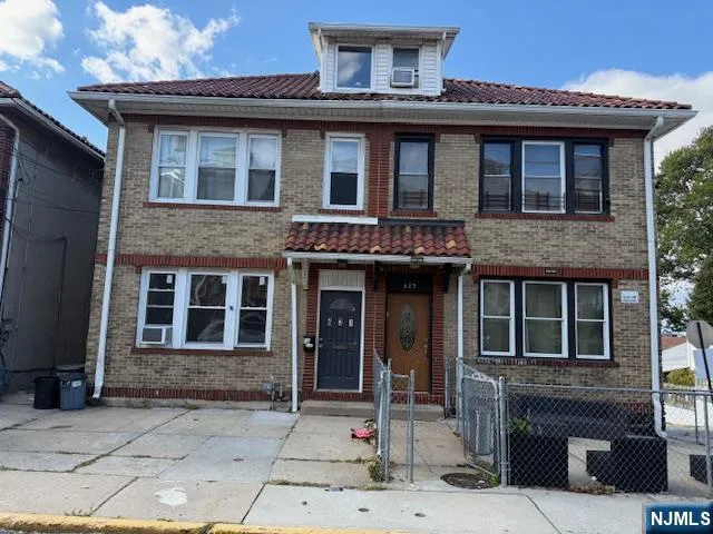 a front view of a house with glass windows