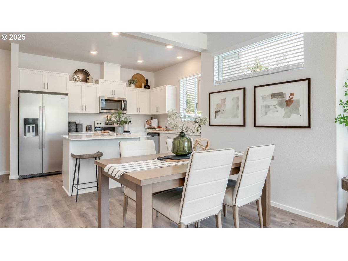 3528 Southwest Hartley Avenue Gresham, OR 97080 - Photo 5 of 25 a kitchen with a table and chairs