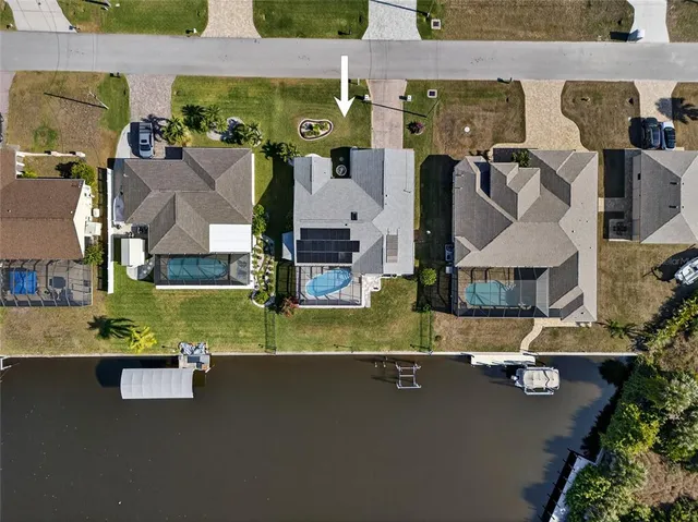 an aerial view of a house with swimming pool