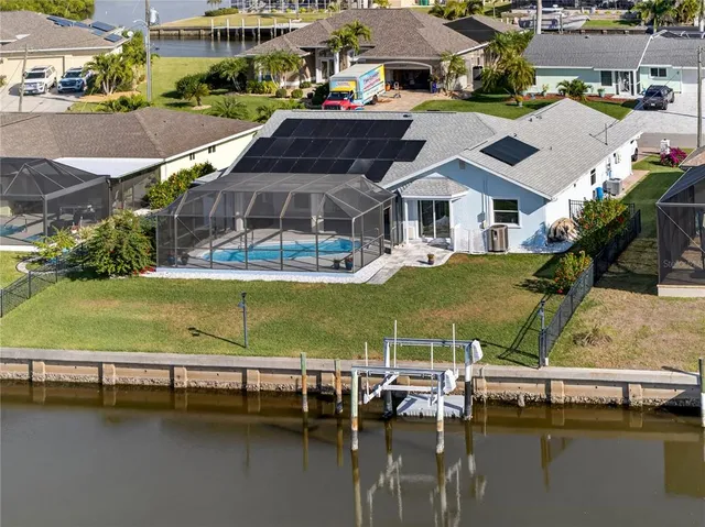 an aerial view of a house with a ocean view