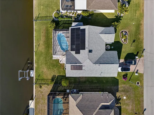 an aerial view of a house with swimming pool