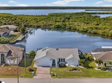 an aerial view of a house with a lake view