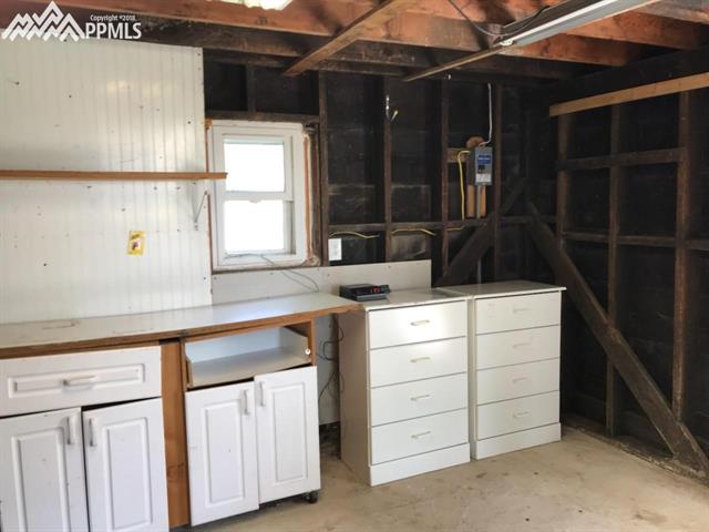 8750 Berridge Road Calhan, CO 80808 - Photo 3 of 4 Inside of well house. Can be used as a workshop or storage area. Has a loft for even more storage space. Additional separate room on the other side, could be used to house livestock.
